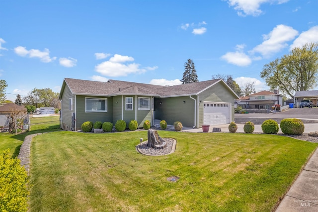 view of front facade featuring a front lawn, driveway, and a garage