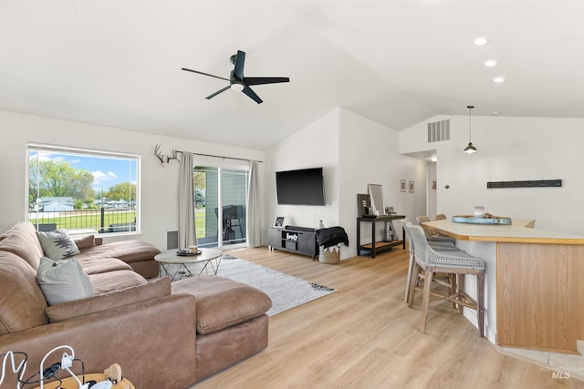 living room with recessed lighting, lofted ceiling, visible vents, light wood-style flooring, and ceiling fan