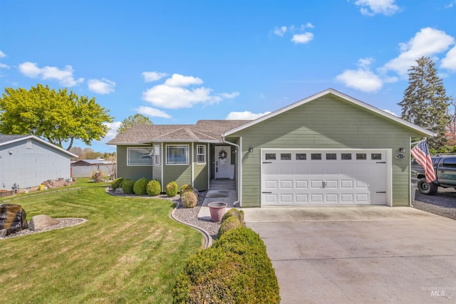 single story home featuring an attached garage, a front yard, and concrete driveway