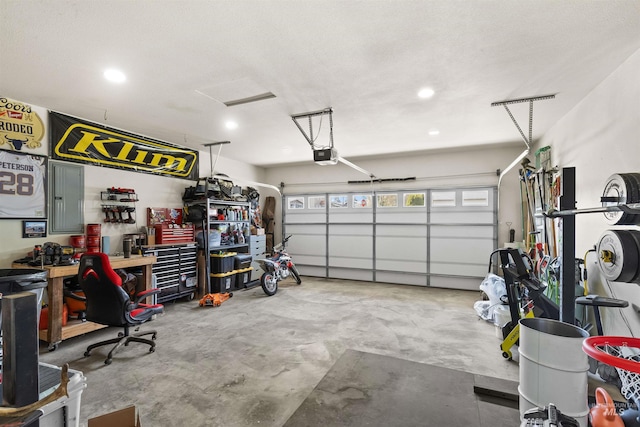 garage featuring recessed lighting and a garage door opener