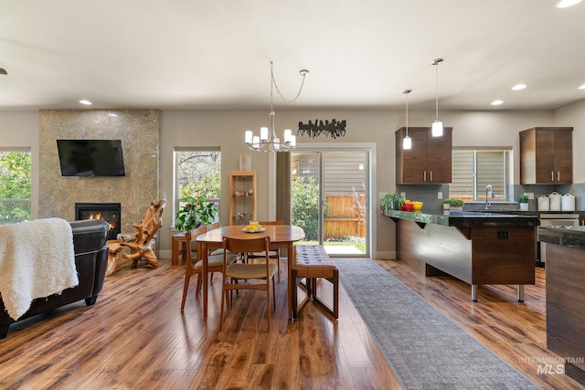 dining area with an inviting chandelier, recessed lighting, and a healthy amount of sunlight