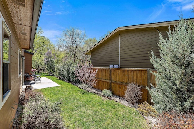 view of yard with a patio and fence