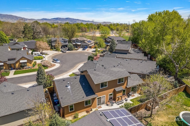 birds eye view of property featuring a mountain view and a residential view