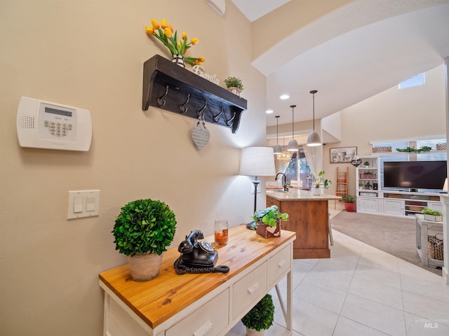 interior space with sink and light tile patterned flooring