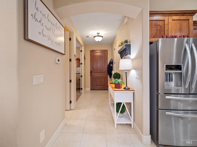 hallway featuring light tile patterned floors