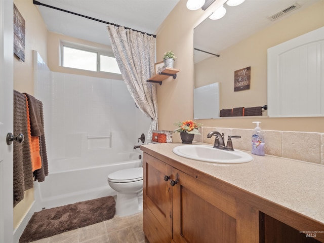 full bathroom featuring vanity, toilet, and shower / bath combo with shower curtain