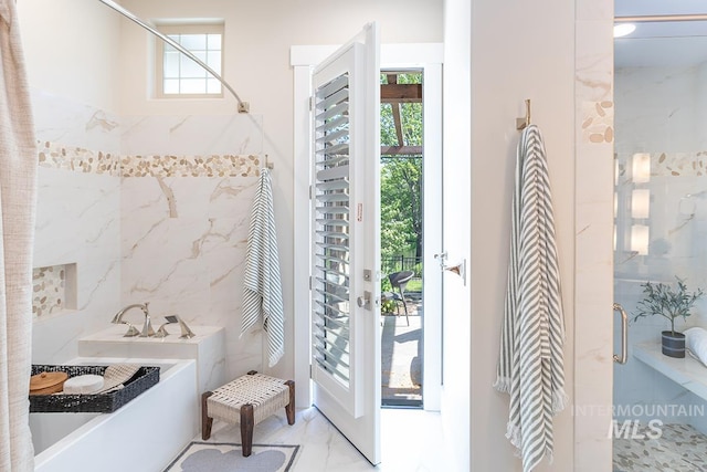 1049 E Riversong Dr, Eagle, ID 83616 - bathroom with a stall shower, tile walls, and a garden tub