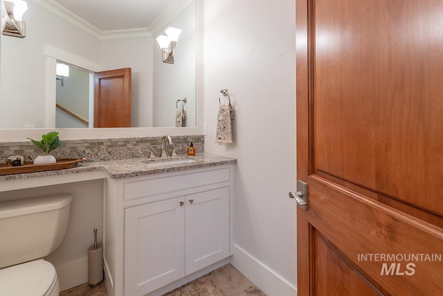 1049 E Riversong Dr, Eagle, ID 83616 - bathroom with toilet, vanity, ornamental molding, and baseboards