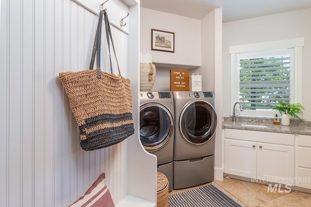 1049 E Riversong Dr, Eagle, ID 83616 - washroom with a sink, washing machine and dryer, and light tile patterned floors