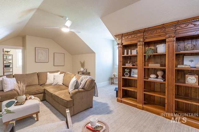 1049 E Riversong Dr, Eagle, ID 83616 - living room with lofted ceiling, a ceiling fan, light carpet, baseboards, and a textured ceiling