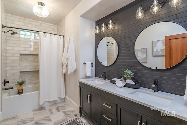 1049 E Riversong Dr, Eagle, ID 83616 - bathroom featuring shower / bathtub combination with curtain, double vanity, decorative backsplash, and baseboards