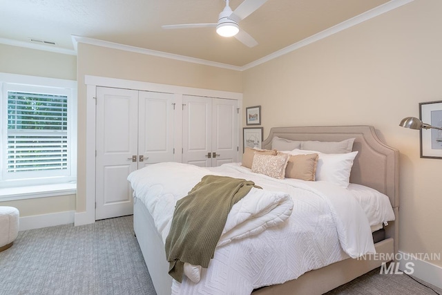 1049 E Riversong Dr, Eagle, ID 83616 - bedroom featuring multiple closets, carpet floors, ornamental molding, baseboards, and ceiling fan