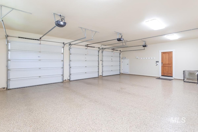 1049 E Riversong Dr, Eagle, ID 83616 - garage featuring a garage door opener and baseboards