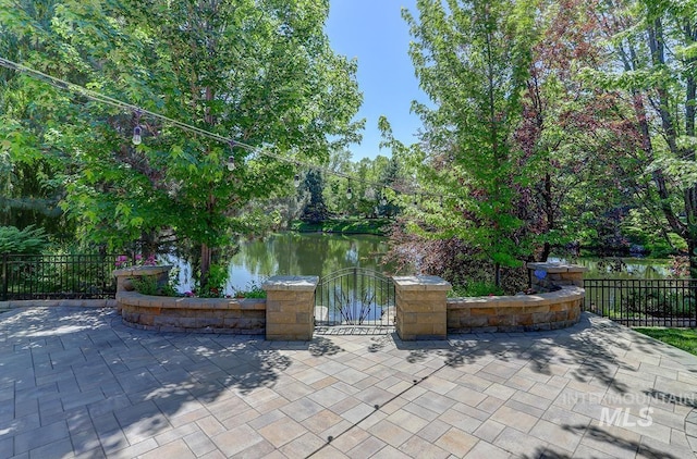1049 E Riversong Dr, Eagle, ID 83616 - view of patio / terrace with a water view