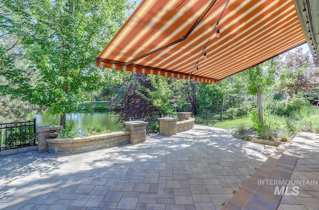1049 E Riversong Dr, Eagle, ID 83616 - view of patio featuring a water view