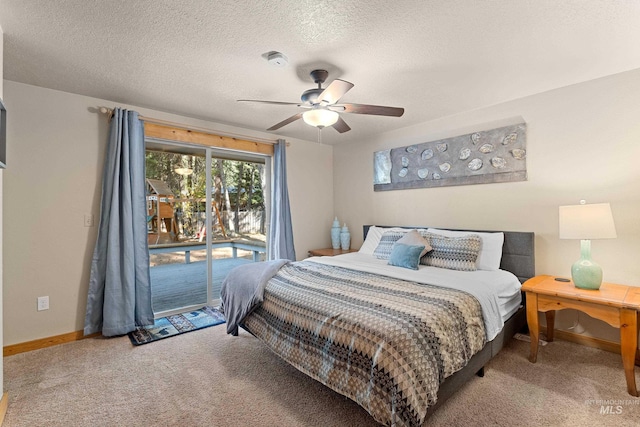 305 Gabi Ln, Mccall, ID 83638 - carpeted bedroom featuring a textured ceiling, access to exterior, baseboards, and a ceiling fan