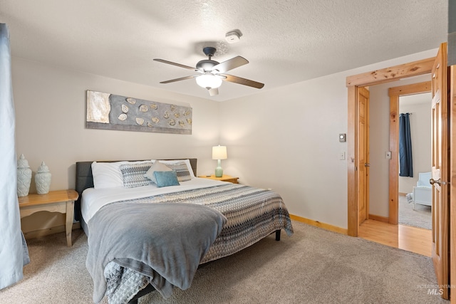 305 Gabi Ln, Mccall, ID 83638 - bedroom with ceiling fan, light colored carpet, baseboards, and a textured ceiling