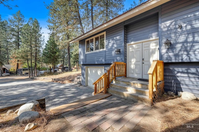 entrance to property with a garage