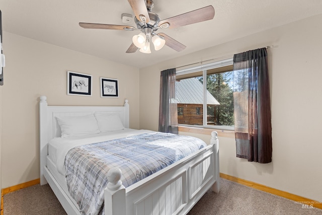305 Gabi Ln, Mccall, ID 83638 - carpeted bedroom with baseboards and ceiling fan