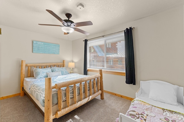 305 Gabi Ln, Mccall, ID 83638 - bedroom with a textured ceiling, baseboards, a ceiling fan, and carpet floors