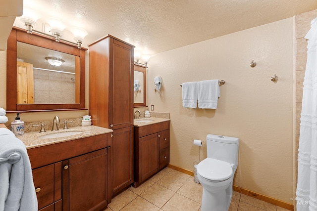 305 Gabi Ln, Mccall, ID 83638 - bathroom with toilet, tile patterned floors, two vanities, and a sink