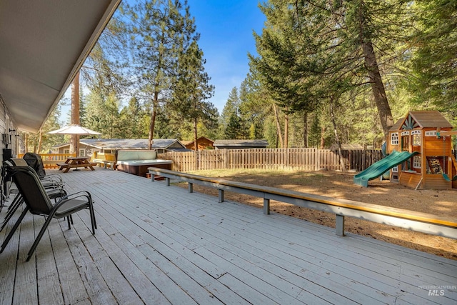 305 Gabi Ln, Mccall, ID 83638 - deck featuring a playground, a jacuzzi, and fence