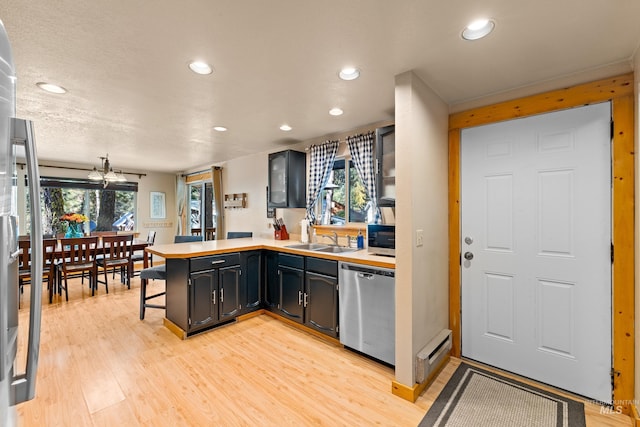305 Gabi Ln, Mccall, ID 83638 - bar with stainless steel appliances, recessed lighting, light wood-style flooring, and a sink