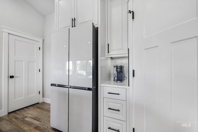 4064 China Ridge Dr, Kimberly, ID 83341 - kitchen with freestanding refrigerator, white cabinetry, dark wood-style floors, light countertops, and backsplash