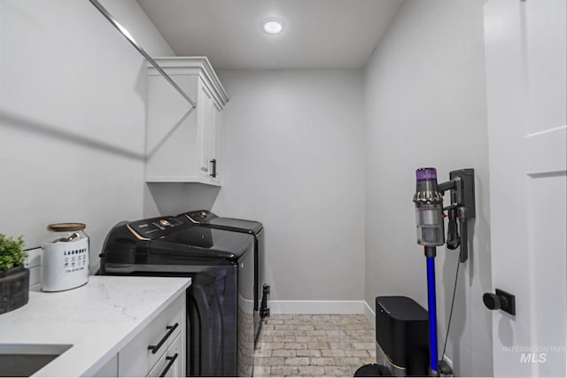4064 China Ridge Dr, Kimberly, ID 83341 - washroom with cabinet space, separate washer and dryer, and baseboards