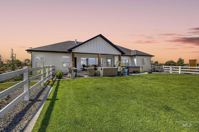 4064 China Ridge Dr, Kimberly, ID 83341 - rear view of property with an outdoor hangout area, board and batten siding, a patio area, and roof with shingles