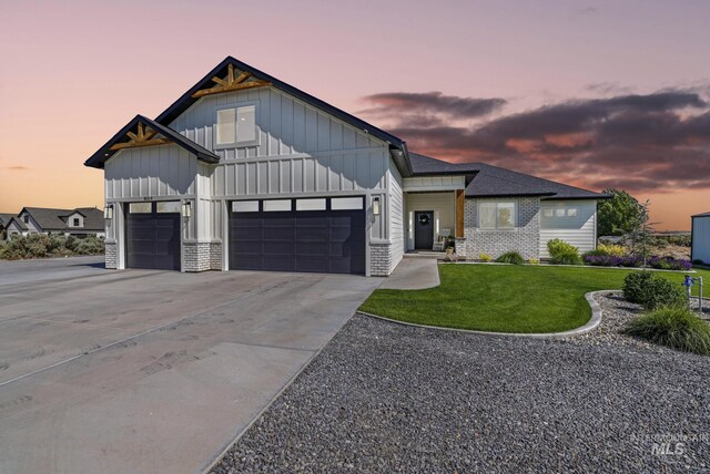 4064 China Ridge Dr, Kimberly, ID 83341 - modern farmhouse with board and batten siding, a garage, driveway, and a lawn