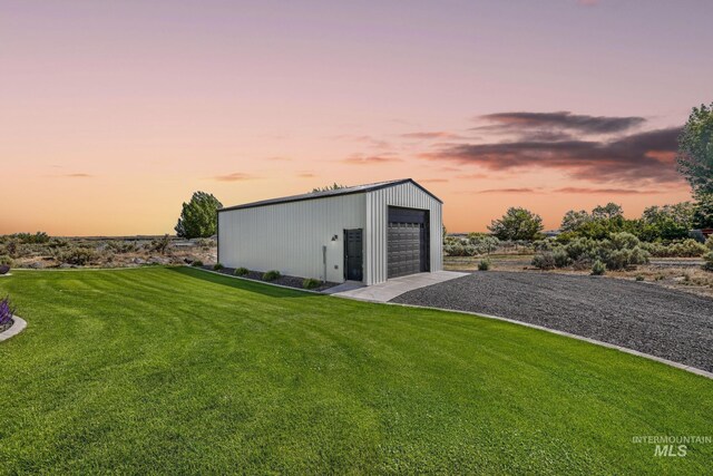 4064 China Ridge Dr, Kimberly, ID 83341 - outdoor structure at dusk with a lawn and driveway