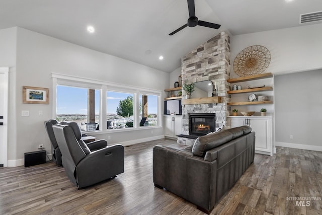 4064 China Ridge Dr, Kimberly, ID 83341 - living room with ceiling fan, a stone fireplace, wood finished floors, high vaulted ceiling, and baseboards