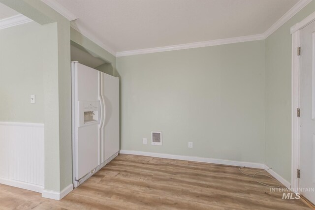 2445 Orchard Rd, Council, ID 83612 - empty room with light wood-style flooring, crown molding, and baseboards