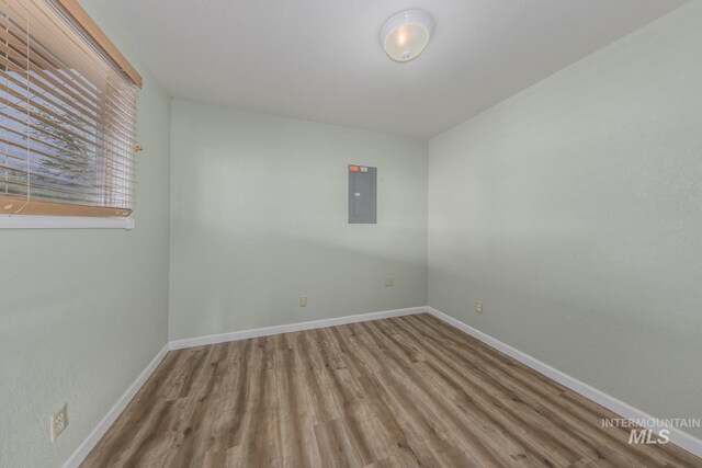 2445 Orchard Rd, Council, ID 83612 - spare room featuring electric panel, wood finished floors, and baseboards