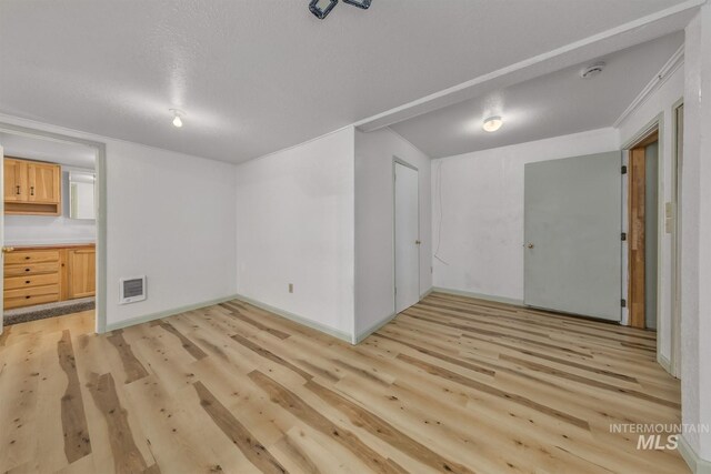 2445 Orchard Rd, Council, ID 83612 - unfurnished room featuring light wood-style floors, baseboards, a smoke detector, and a textured ceiling