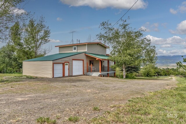2445 Orchard Rd, Council, ID 83612 - view of front of property with a garage and dirt driveway
