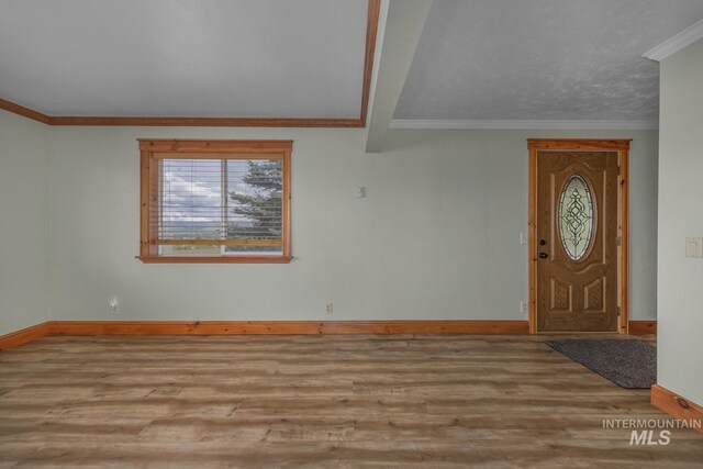 2445 Orchard Rd, Council, ID 83612 - entrance foyer with baseboards, wood finished floors, and crown molding