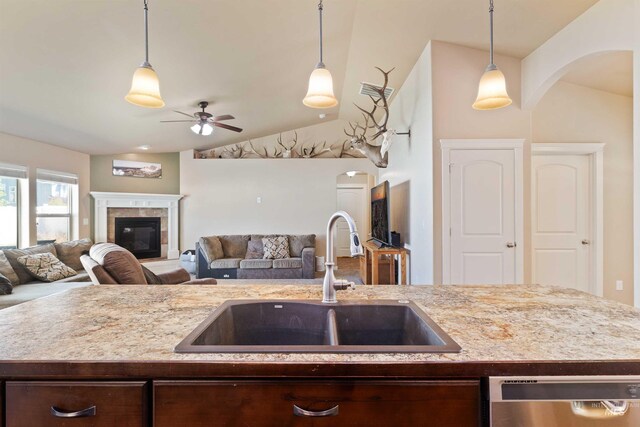 2448 Village St, Twin Falls, ID 83301 - kitchen featuring a sink, dishwasher, open floor plan, ceiling fan, and dark brown cabinetry