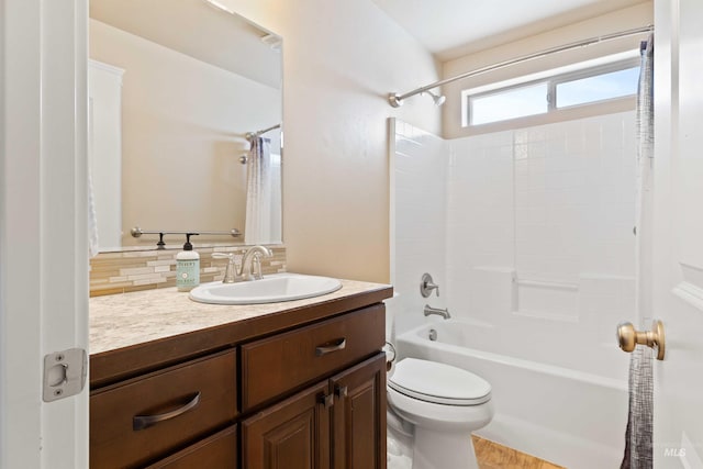 2448 Village St, Twin Falls, ID 83301 - full bath featuring backsplash, toilet, vanity, and shower / bathtub combination