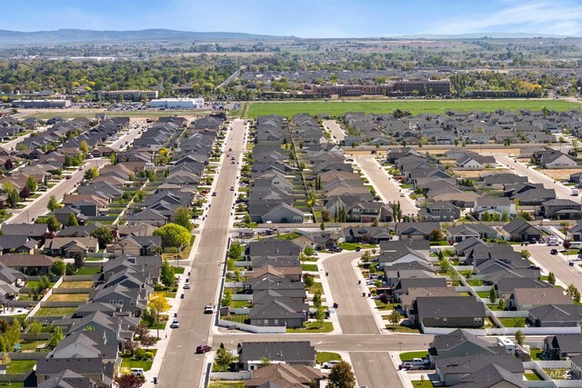 2448 Village St, Twin Falls, ID 83301 - aerial overview of property's location with nearby suburban area and a mountain backdrop