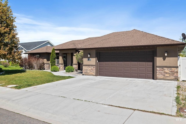 2448 Village St, Twin Falls, ID 83301 - view of front facade with stone siding, a garage, a front lawn, stucco siding, and driveway