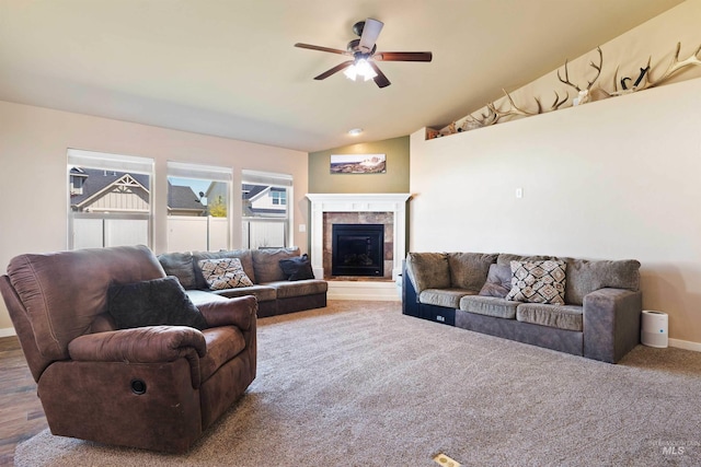 2448 Village St, Twin Falls, ID 83301 - living room with a ceiling fan, baseboards, a tile fireplace, and vaulted ceiling