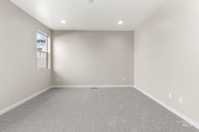 unfurnished room featuring carpet, baseboards, and recessed lighting