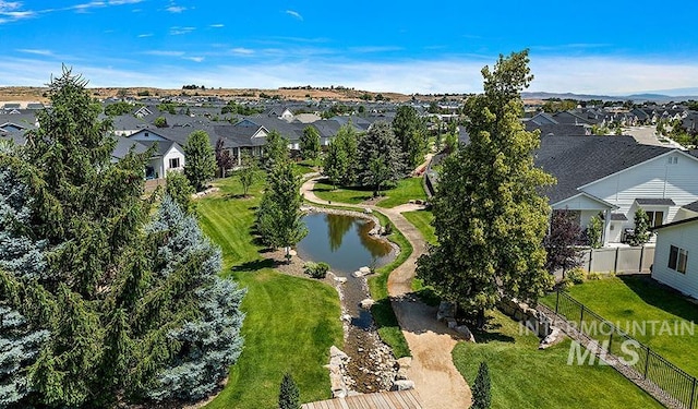 bird's eye view featuring a water view and a residential view