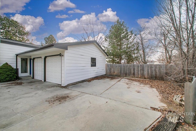 view of property exterior with a garage