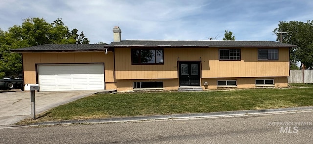 812 Thompson Ave, Nyssa, OR 97913 - split foyer home featuring driveway, a garage, and a chimney