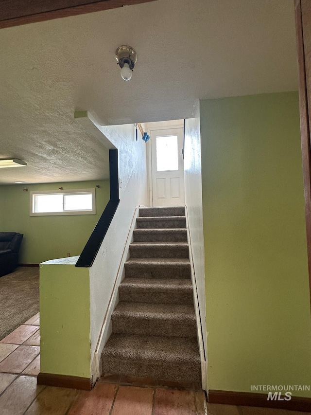 812 Thompson Ave, Nyssa, OR 97913 - stairs featuring baseboards and a textured ceiling