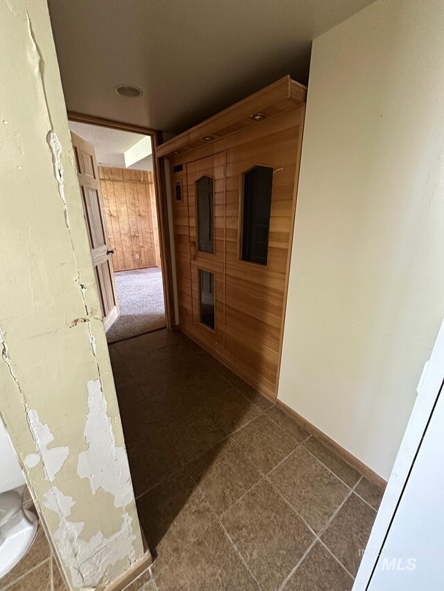 812 Thompson Ave, Nyssa, OR 97913 - hallway with dark tile patterned flooring and baseboards