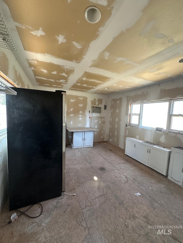 812 Thompson Ave, Nyssa, OR 97913 - kitchen with white cabinetry and freestanding refrigerator